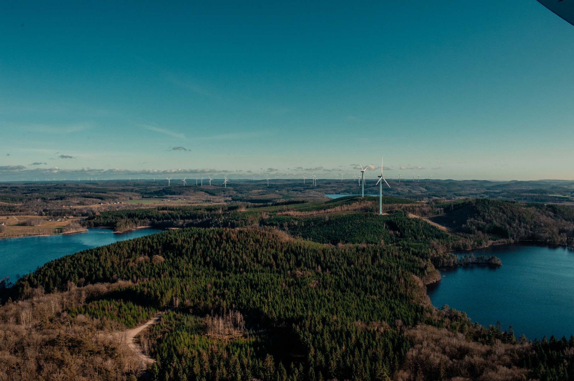 Aerial view of wind turbines across Scandinavian landscape